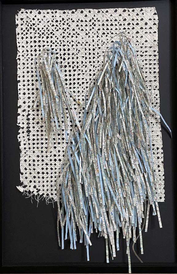 An artwork called Roam, made from a shredded map that has been sewn to a piece of handmade paper. By Virginia Beach Artist, Maggie Kerrigan