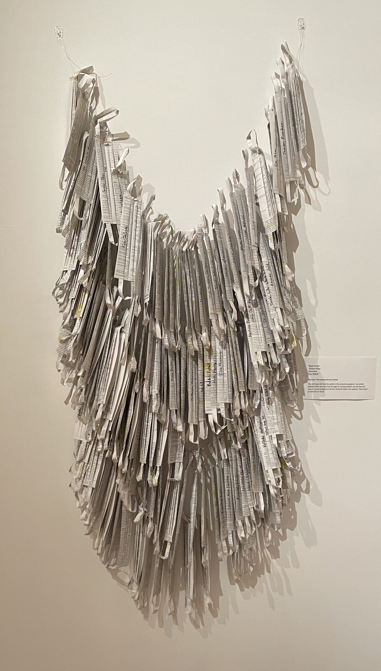 Pandemic Heroes is an artwork by Maggie Kerrigan that consists of 200 paper face masks made from a nursing textbook.