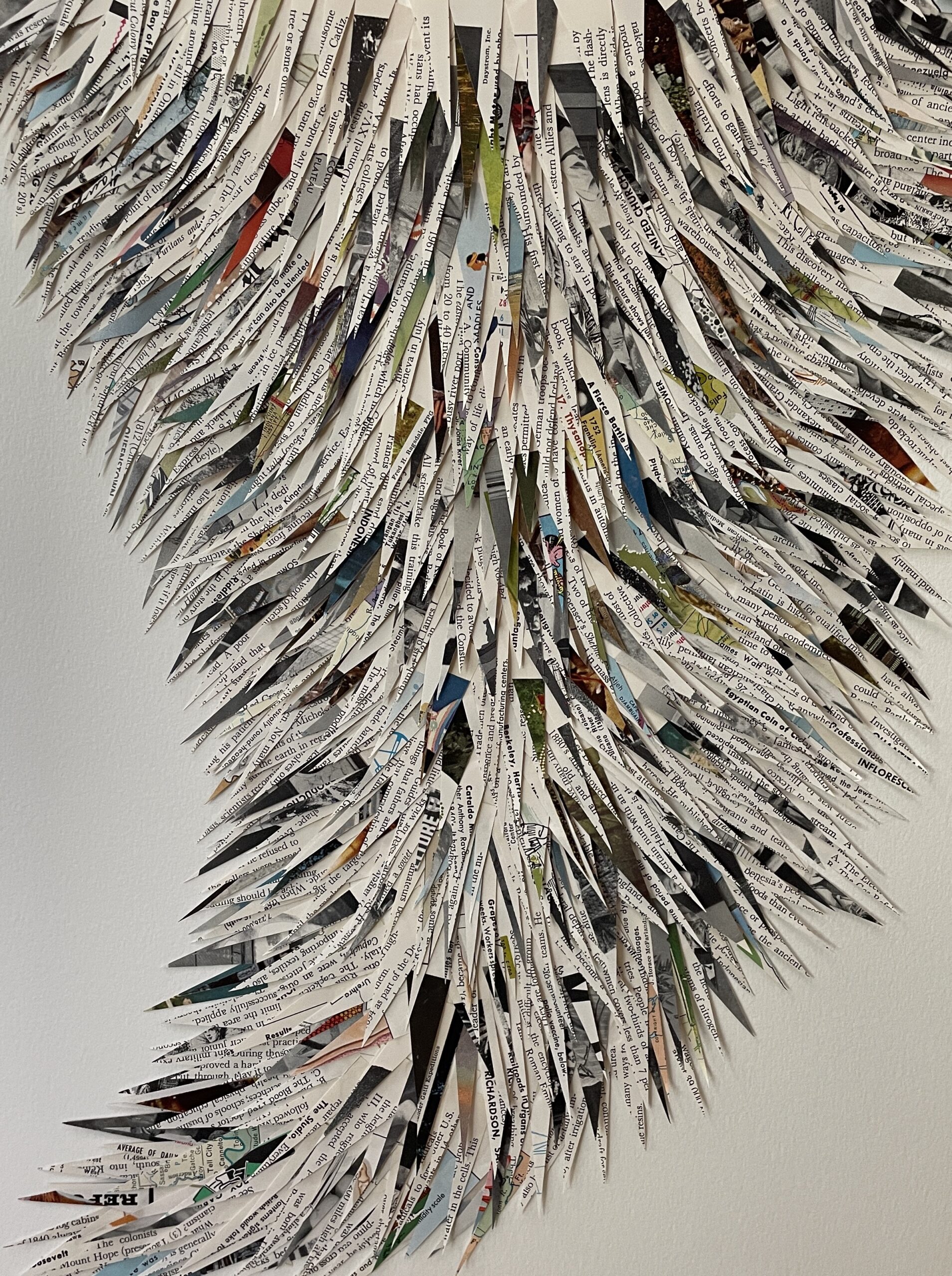 A collage by artist Maggie Kerrigan that implies melting glaciers and uses paper cut from encyclopedias.