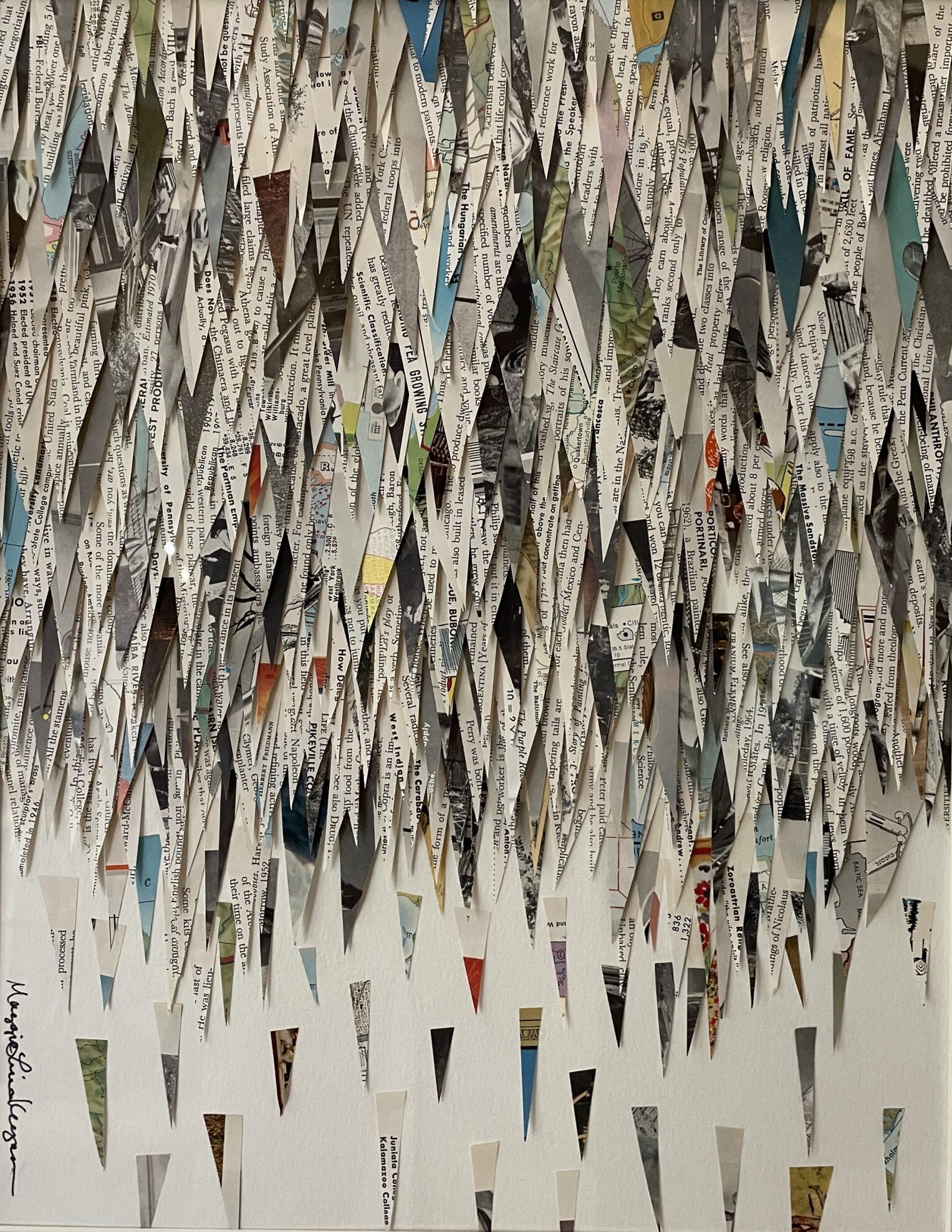 An artwork by Maggie Kerrigan showing small bits of paper from an encyclopedia, collaged to imply a heavy rainstorm.