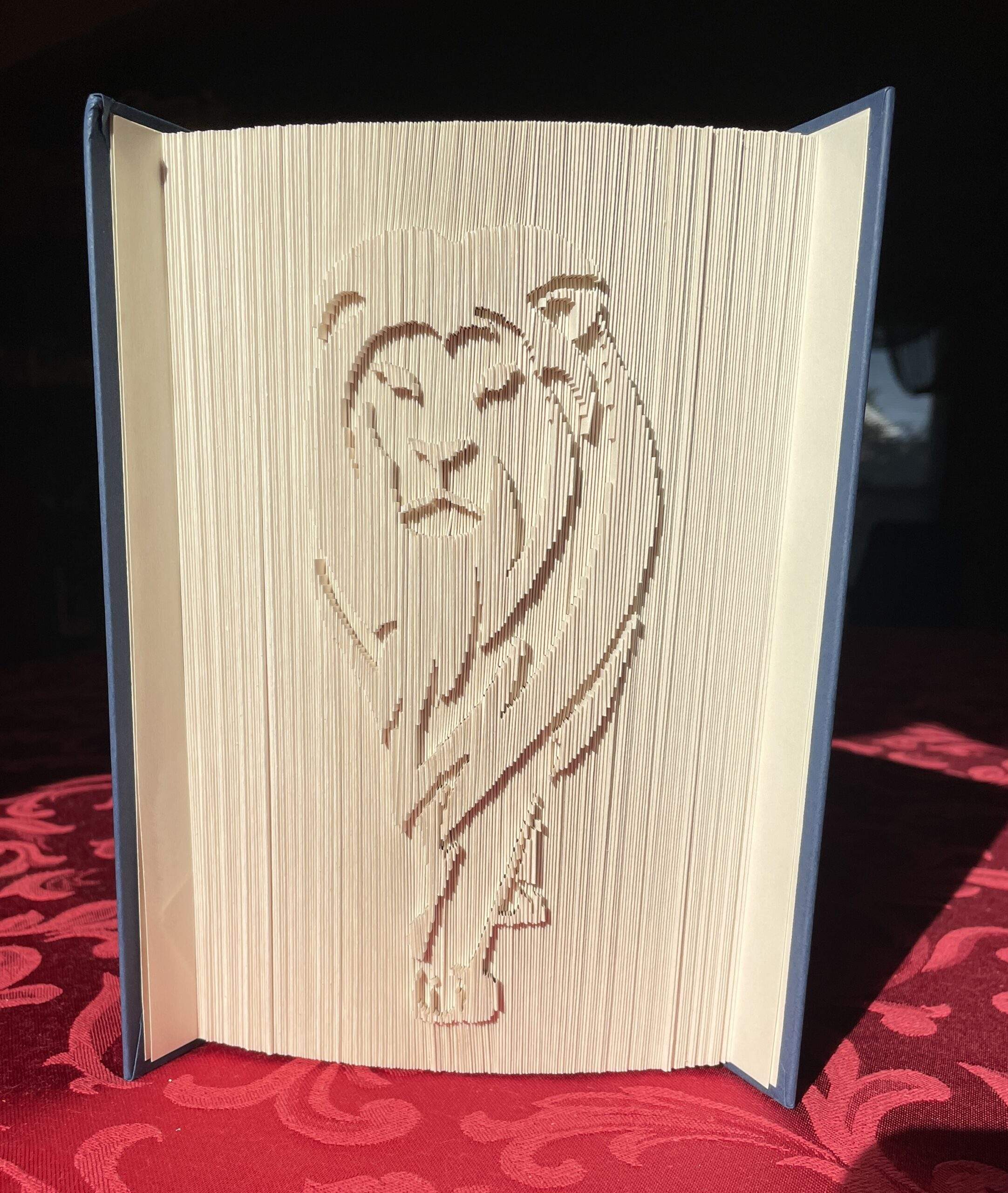 Book sculpture by artist Maggie Kerrigan of a lion.
